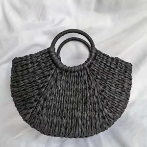 Handmade black straw handbag with semi-circular woven design and round top handles