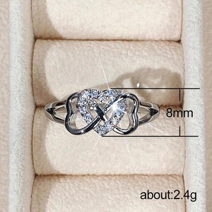 Silver color double heart ring with micro-pave zircons on beige velvet gift box