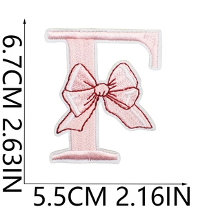 Detail of pink bow letter F embroidered patch showing 6.7cm height and 5.5cm width
