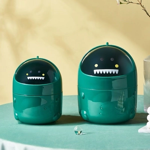 Set of two cute green dinosaur mini desktop trash cans with flip lids for home office decor