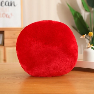 Round red billiards plush cushion made of long soft fur on a wooden table setup