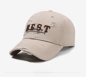 Detail shot of distressed cotton baseball cap with vintage frayed edges and embroidery