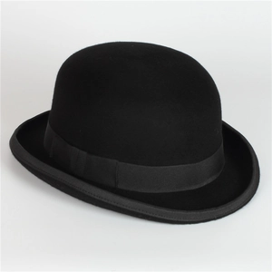 Detail view of black wool felt derby hat showing the satin ribbon and curled brim