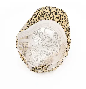 Detail view of the breathable mesh lining and fine stitching inside leopard newsboy cap