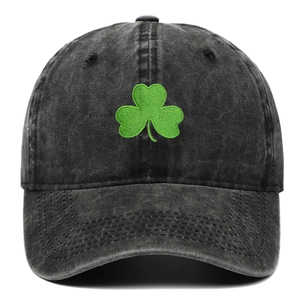 Faded grey washed cotton baseball cap with green clover embroidery and curved brim