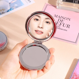 Handheld double-sided folding makeup mirror with quicksand finish and metal frame