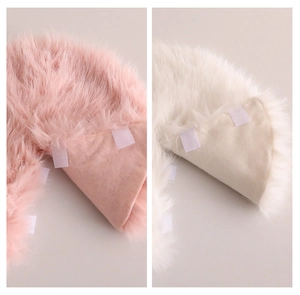 Close-up of plush faux fur Christmas tree skirt with velcro strap details