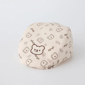 Detail of baby bear embroidery and Bangbi print on a cream cotton twill beret hat