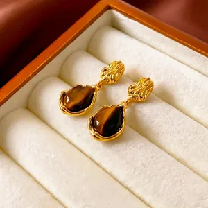 Vintage teardrop tiger eye earrings with gold plating in a luxury velvet jewelry box
