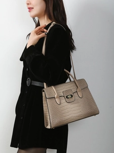 Elegant khaki crocodile embossed handbag with metal lock and adjustable shoulder strap