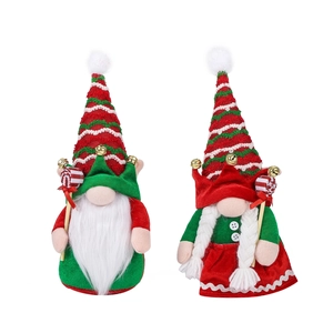 Festive male and female Christmas gnomes dolls with striped hats and candy canes