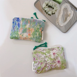 Detail of floral oil painting canvas pouches with zippers and simple wish labels