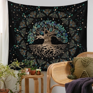 Detail shot of black Tree of Life tapestry in a cozy bohemian living room interior
