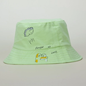 Detailed close-up of mint green bucket hat with hand-drawn Power of Love graffiti