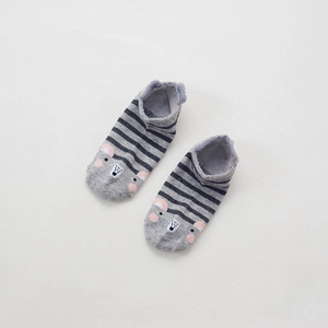 Detail shot of gray striped cotton socks featuring a cute cartoon animal face design