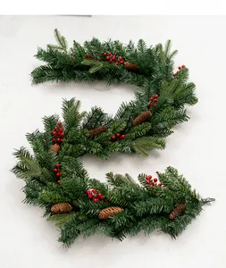 Detail of luxury PE mixed Christmas garland with red berries and pine cones decoration