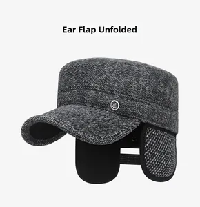 Winter flat top cap detail showing unfolded ear flaps with warm black lining