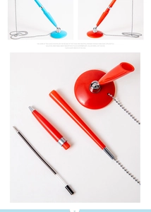Close-up of counter pens with anti-theft bead chains and detachable round bases