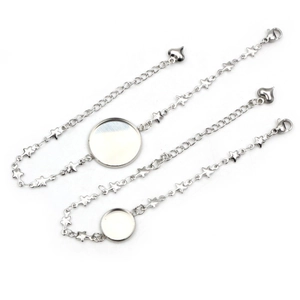 Detailed view of stainless steel bracelet base settings with star charms on white background
