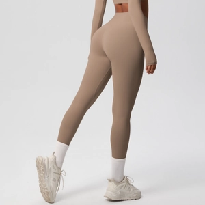 Close-up of high-waist yoga leggings showing seamless push-up design and earthy brown fabric