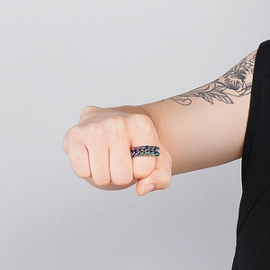 Unisex rainbow titanium steel Cuban chain ring shown on model hand in trendy style