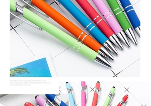Detail view of colorful matte click pens with silver clips and stylus tips on grid background