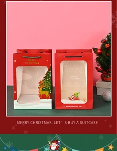 Red Christmas gift bags with transparent window featuring gold reindeer and Santa motifs