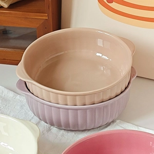 Stack of ribbed ceramic dessert bowls with double handles in assorted pastel colors