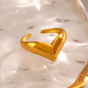 Minimalist V-shaped open ring in polished gold finish on water texture surface