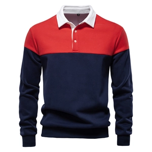 Close-up of polo shirt collar with navy and red color blocking and white knitted fabric