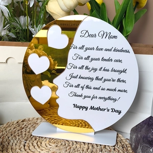 Macro view of acrylic Mother's Day plaque with gold mirror heart frames and poem