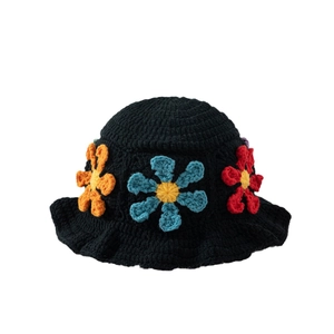 Handcrafted black crochet bucket hat with colorful floral knit patterns for women