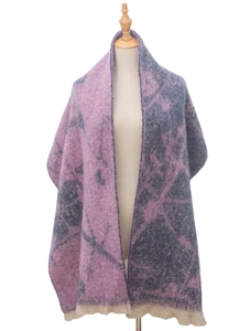 Close-up of pink and grey jacquard flower pattern with delicate short fringe tassels