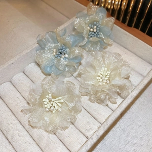 Elegant organza flower earrings with pearl centers in light blue and cream colors