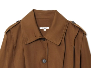 Detail of a brown long-sleeved lapel jacket featuring buttoned epaulets and twill texture