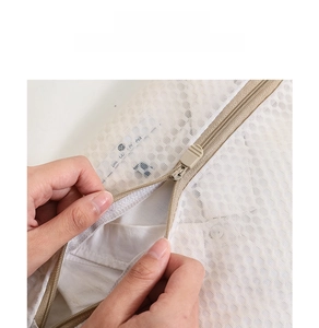 Close-up of fine mesh laundry bag showing durable zipper and high-quality polyester fabric