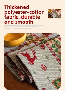 Detail of Christmas table runner fabric showing thick jacquard reindeer and tree patterns