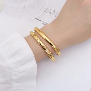 Minimalist gold plated twist cuff bracelets with star zircon accents on female wrist