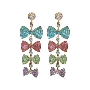 Luxury long tassel drop earrings with four colorful crystal-studded bows in gold finish