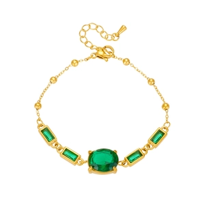 Elegant gold titanium chain bracelet with green geometric gemstones and zircons