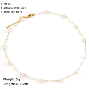 Detail of 18K gold plated stainless steel necklace with pink gemstones and pearls