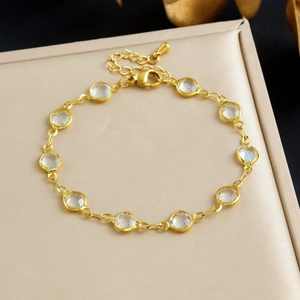 Gold stainless steel chain bracelet with clear crystal accents in a jewelry gift box