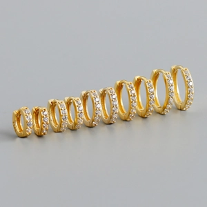 Five pairs of gold S925 sterling silver hoop earrings with zircon, various sizes on gray background