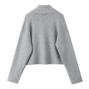 Close-up of the grey knit cardigan showing high-neck fold detail and soft texture