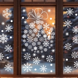 White snowflake window stickers with Christmas bow ornament on glass for home decor