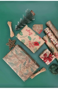 Flat lay of retro kraft Christmas wrapping paper with jute twine and festive gift tags
