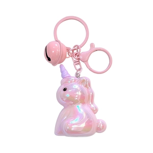 Cute iridescent pink electroplated acrylic unicorn keychain with matching bell accessory.