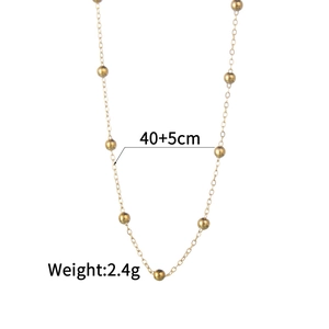 Detailed view of golden bead chain necklace with 40+5cm length and 2.4g weight specifications