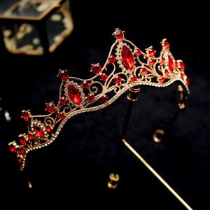 Baroque gold bridal crown with red rhinestones and crystals on black display stand