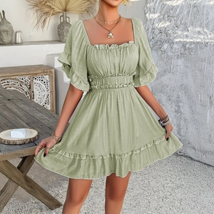 Women's light green summer mini dress with ruffled sleeves and casual boho resort style